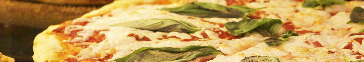 Eating Italian Pizza at Alfresco's Italian Bistro restaurant in Oneonta, NY.